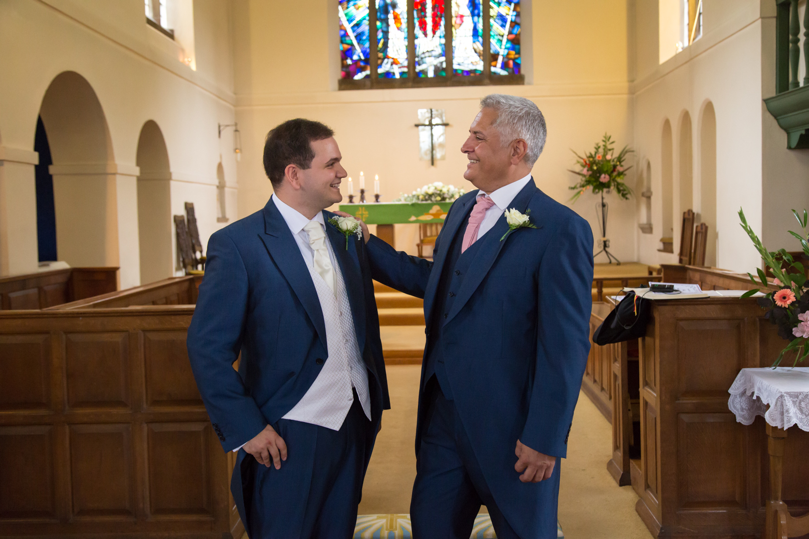 The Groom and his father photographed at St Lawrence's Church, Eastcote, Pinner Middlesex by Tim Durham of Pinner Wedding Photograph