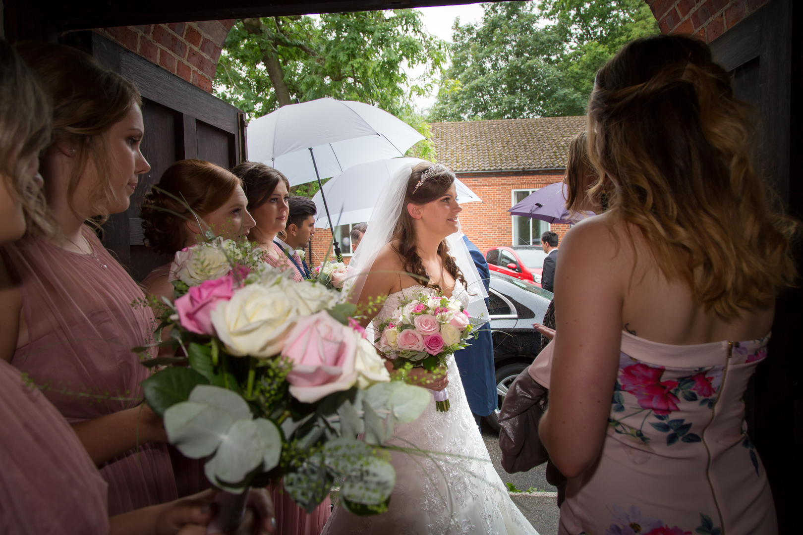 The Bride & Bridesmaids photographed at St Lawrence's Church, Eastcote, Pinner Middlesex by Tim Durham of Pinner Wedding Photograph