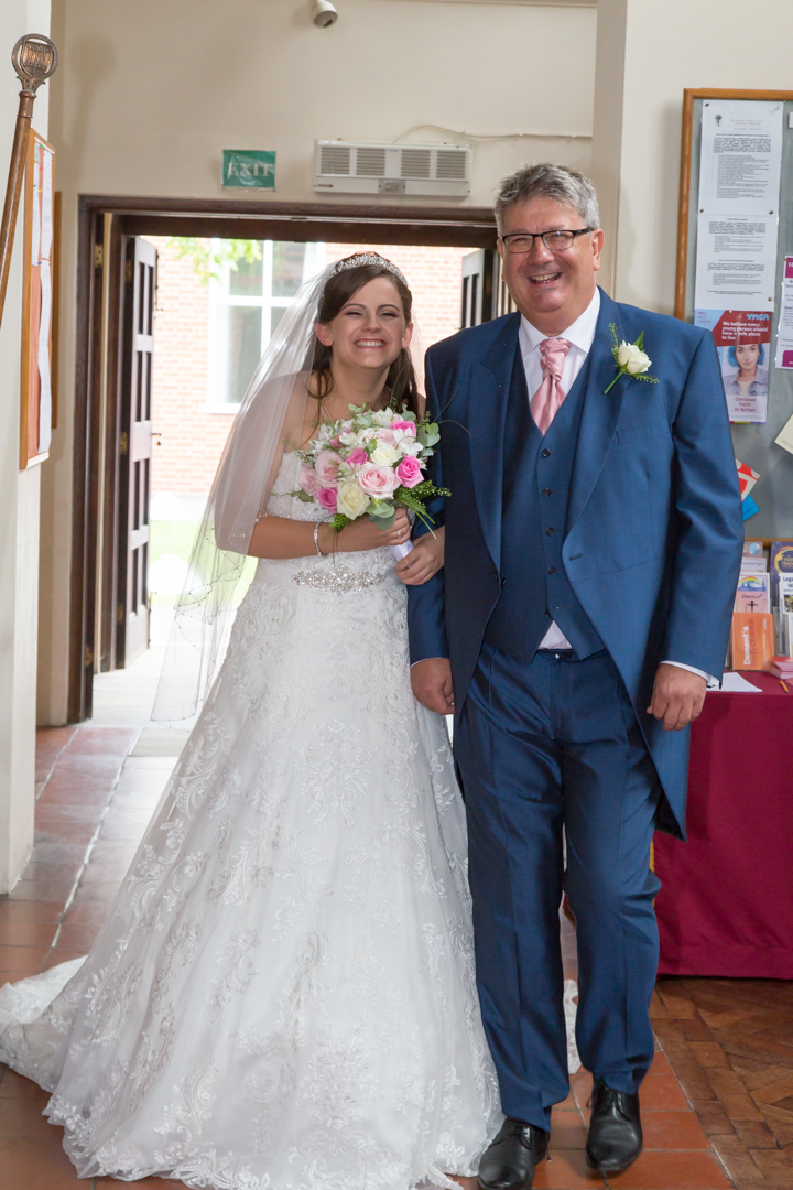 Naomi and her father photographed at St Lawrence's Church, Eastcote, Pinner, Middlesex by Tim & Linda Durham of Pinner Wedding Photograph