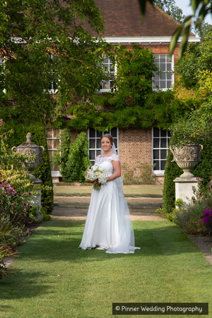 wedding-dress-Bride-gardens-Mickelfield Hall-Sarratt-Hertfordshire